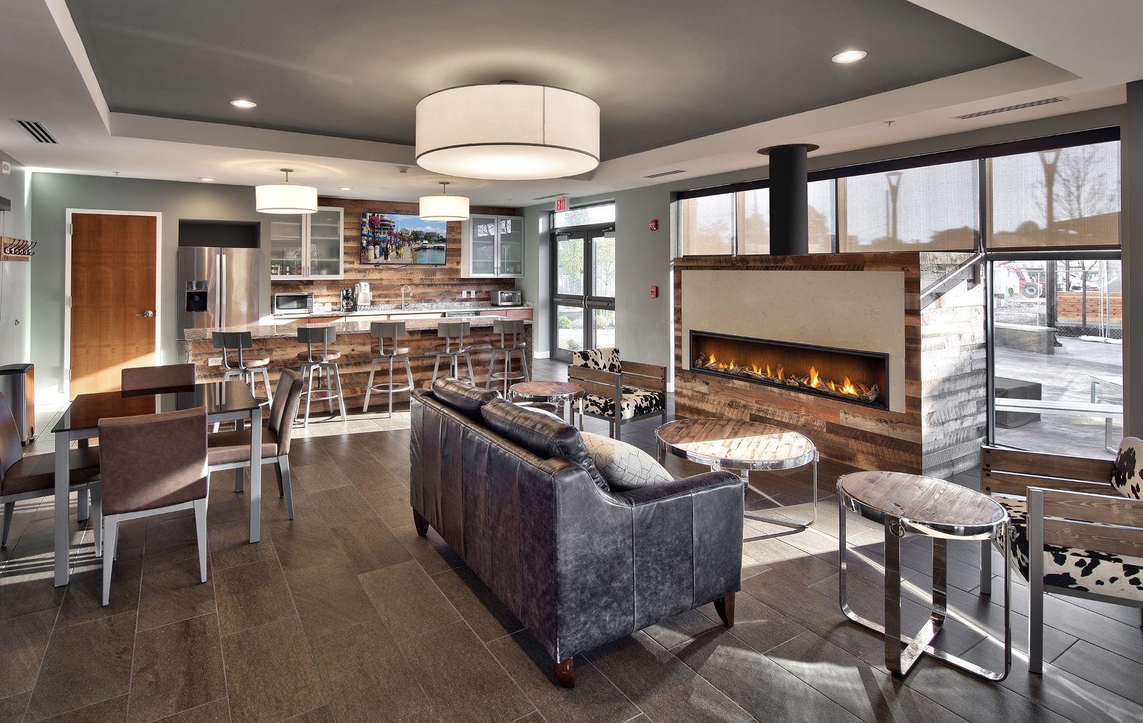 Community room with kitchen bar and fireplace
